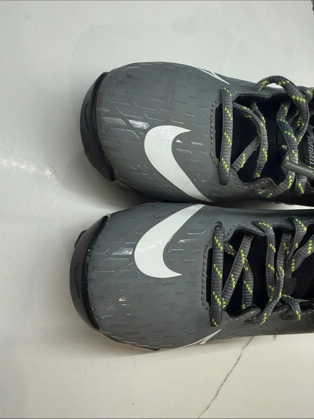 Nike Gray Cleats with White Swoosh and Neon-Lime Accents